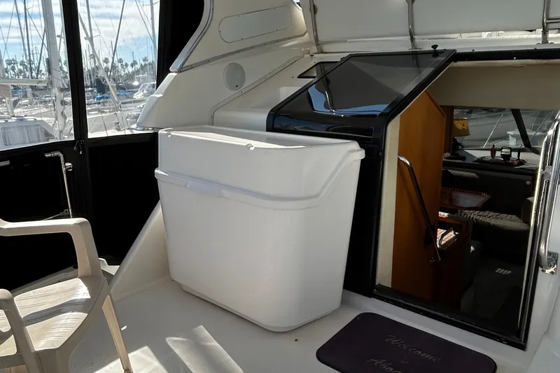 Slide: The Image of 1996 Bayliner 4087 Aft Cabin Motoryacht interior with seating and cabin entrance. - 8