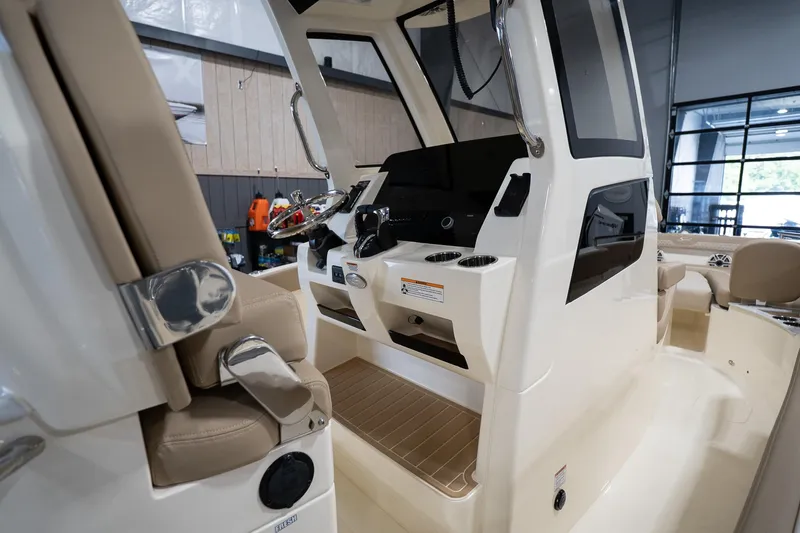 Slide: The Image of 2025 Scout 260 LXF boat interior with modern helm and seating. - 18