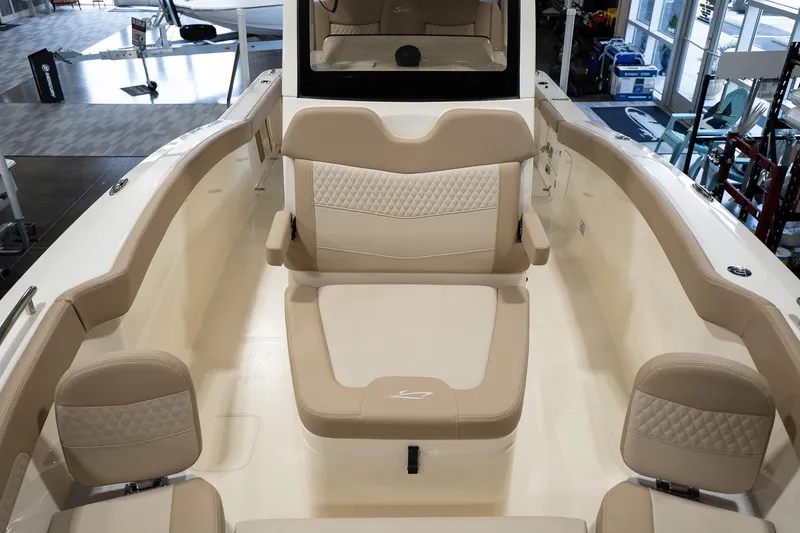 Slide: The Image of 2025 Scout 260 LXF boat interior with beige seating and modern design. - 25