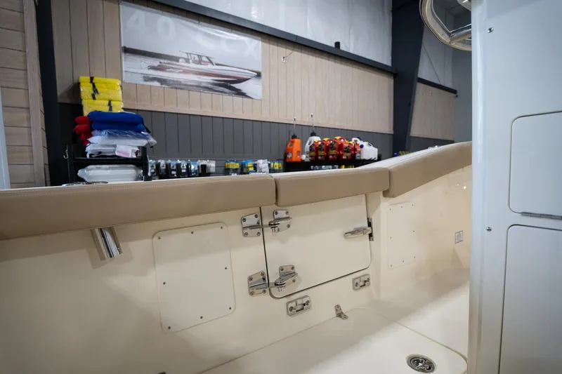 Slide: The Image of 2025 Scout 260 LXF boat interior with storage compartments and safety equipment. - 27