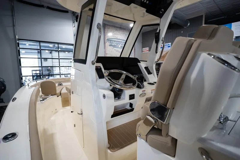 Slide: The Image of 2025 Scout 260 LXF boat interior with modern helm and seating. - 28