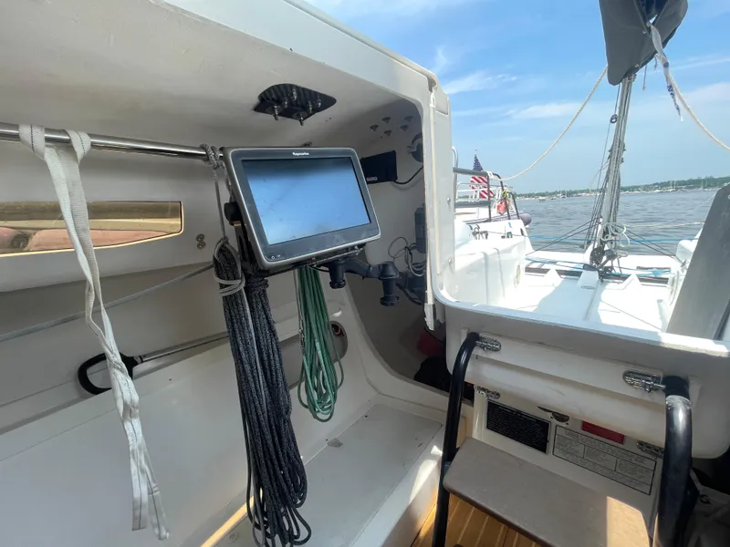 Slide: The Image of Interior view of 2014 J Boats J 88 sailboat with navigation equipment and ropes. - 12