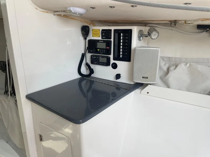 Slide: The Image of Interior of 2014 J Boats J 88 featuring control panel and speaker system. - 13