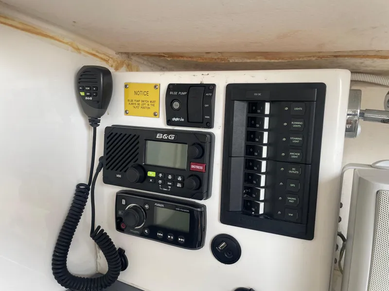 Slide: The Image of Control panel of a 2014 J Boats J 88, featuring B&G electronics and switches. - 14