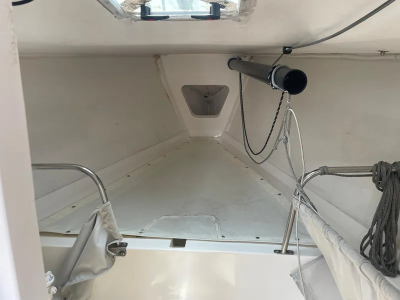 Slide: The Image of Interior view of 2014 J Boats J 88 sailboat cabin, featuring minimalist design and storage space. - 15
