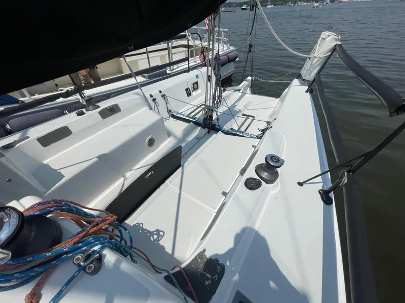 Slide: The Image of 2014 J Boats J 88 sailboat cockpit with ropes and winches on calm water. - 4