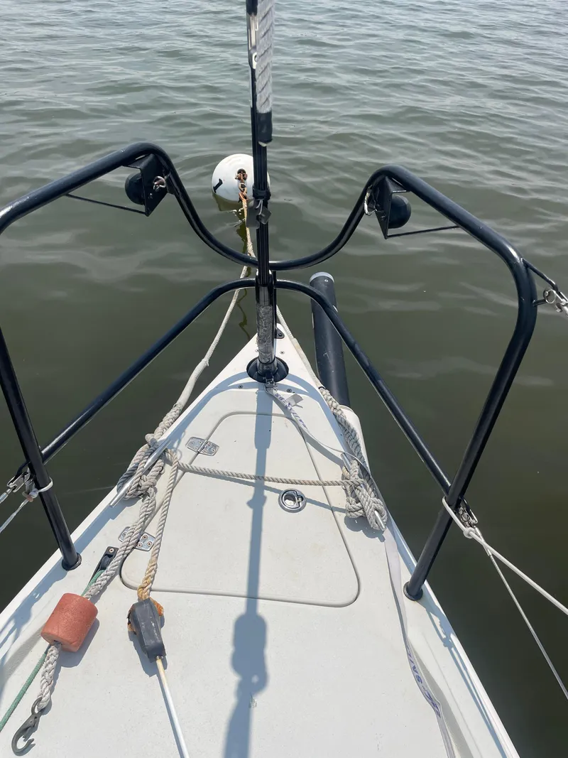 Slide: The Image of Bow of a 2014 J Boats J 88 sailboat with ropes and calm water. - 8