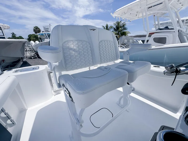 Slide: The Image of 2026 Tidewater 232 CC Adventure boat with dual cushioned seats, sleek design, and modern features. - 10