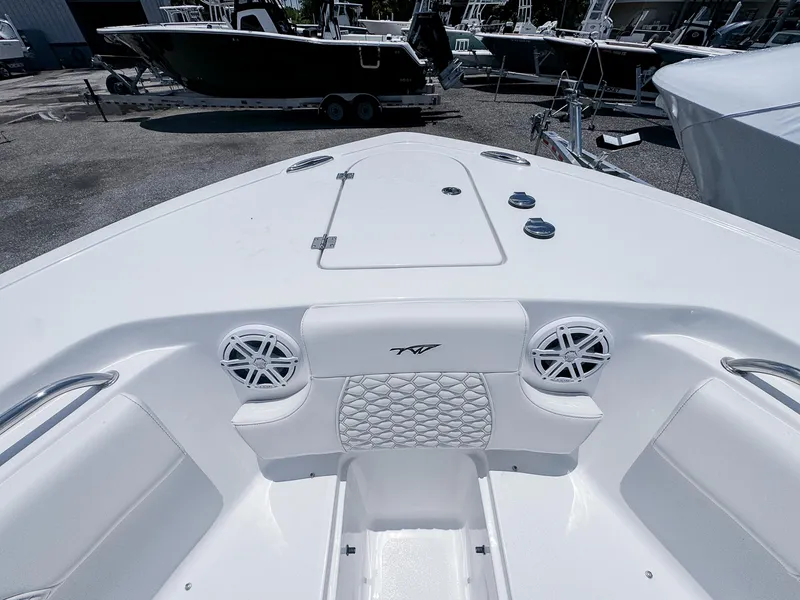 Slide: The Image of 2026 Tidewater 232 CC Adventure boat interior with speakers and seating. - 14