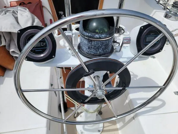 Slide: The Image of Steering wheel and instruments on a 1986 Catalina 30 sailboat cockpit. - 18