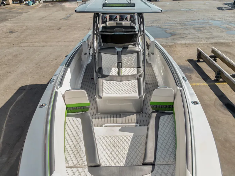 Slide: The Image of 2021 Nor-Tech 390 Sport Center Console boat with spacious seating and modern design. - 14