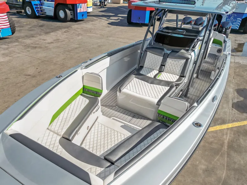Slide: The Image of 2021 Nor-Tech 390 Sport Center Console boat with sleek seating and modern design. - 15
