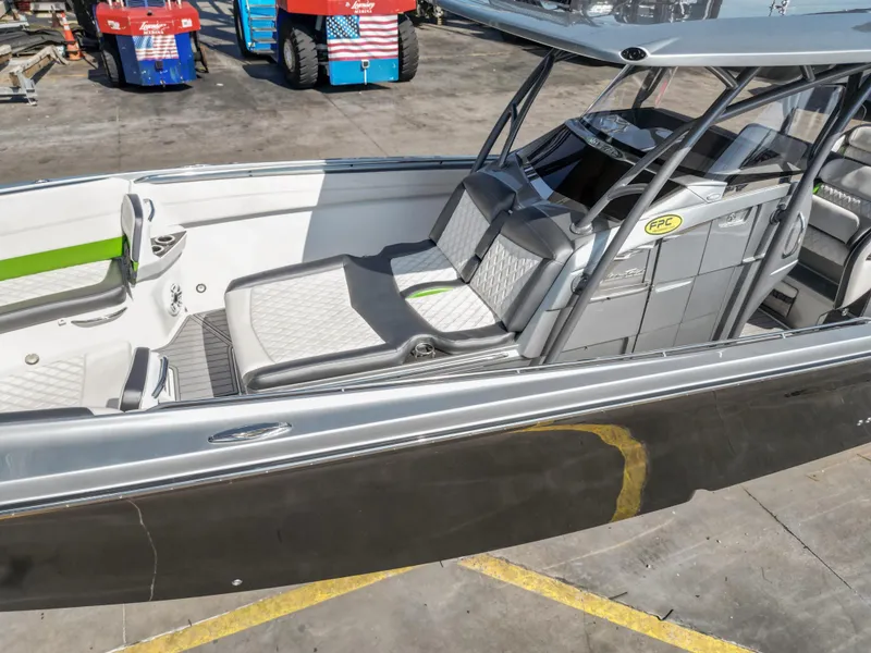 Slide: The Image of 2021 Nor-Tech 390 Sport Center Console boat with sleek seating and modern design. - 16