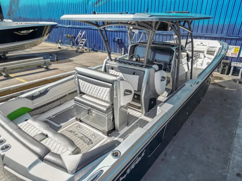 Slide: The Image of 2021 Nor-Tech 390 Sport Center Console boat with sleek design and spacious seating. - 21
