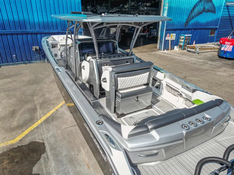 Slide: The Image of 2021 Nor-Tech 390 Sport Center Console boat with sleek design and spacious seating. - 22