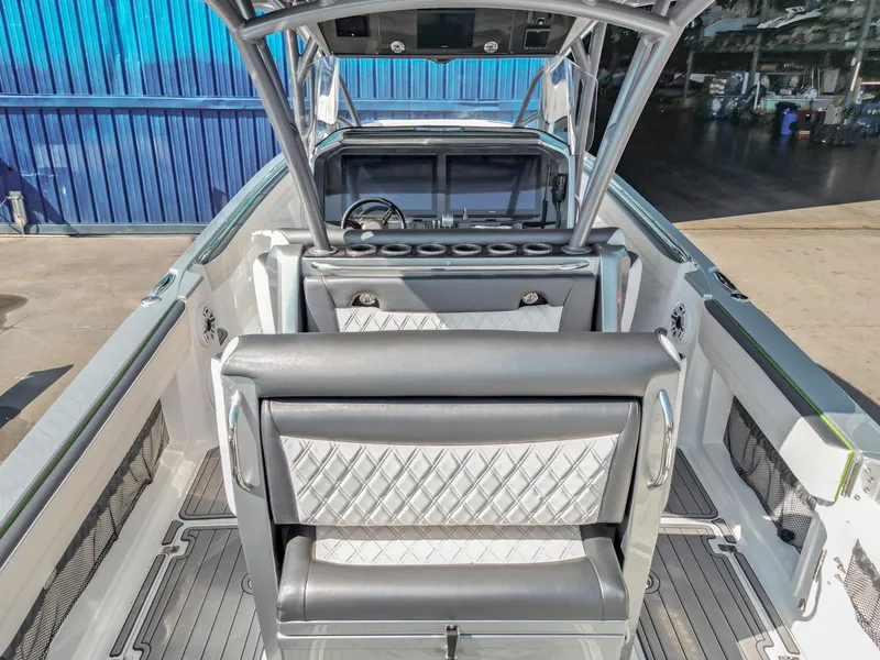 Slide: The Image of 2021 Nor-Tech 390 Sport Center Console interior with sleek seating and modern design. - 23