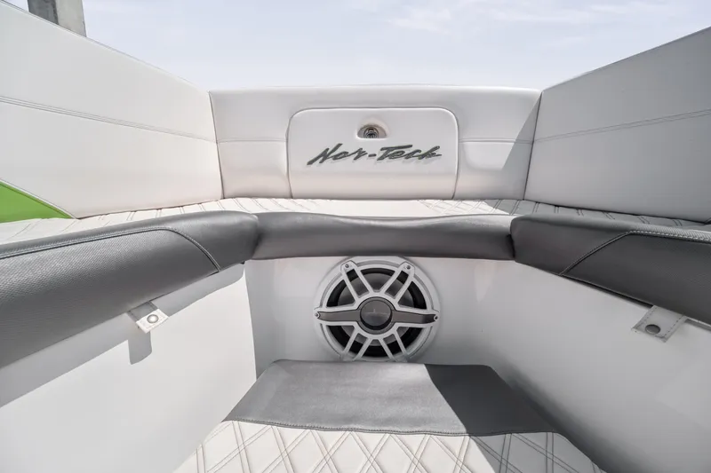 Slide: The Image of 2021 Nor-Tech 390 Sport Center Console interior with speaker and logo detail. - 27