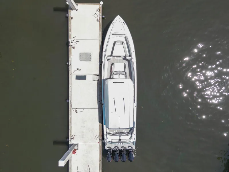 Slide: The Image of Aerial view of 2021 Nor-Tech 390 Sport Center Console docked by pier. - 29