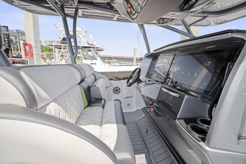 Slide: The Image of 2021 Nor-Tech 390 Sport Center Console interior with modern dashboard and seating. - 36
