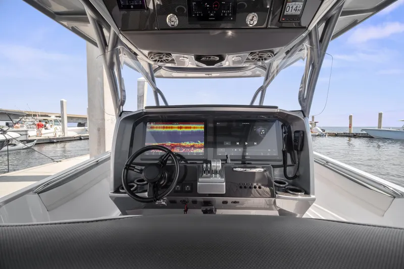 Slide: The Image of 2021 Nor-Tech 390 Sport Center Console dashboard with advanced navigation and control systems. - 37