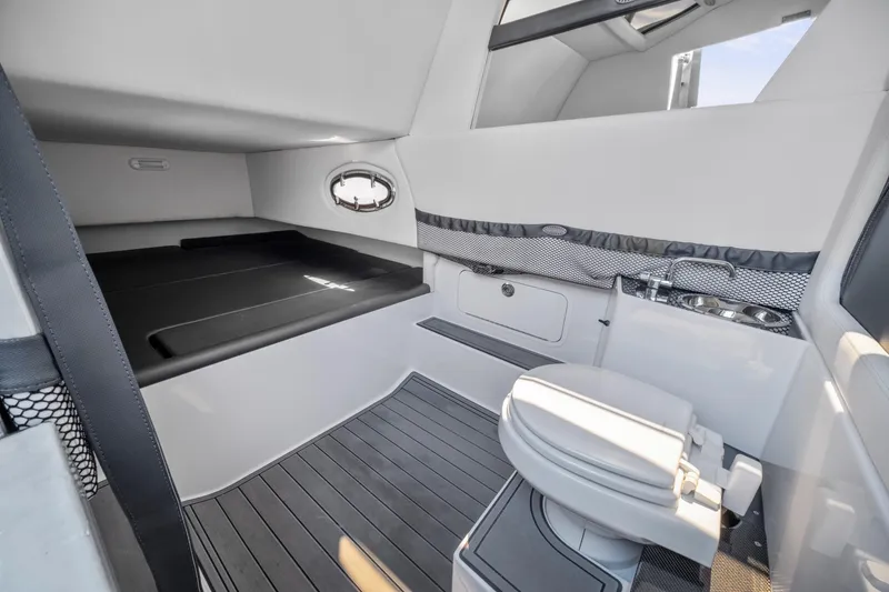 Slide: The Image of 2021 Nor-Tech 390 Sport Center Console cabin with bed, toilet, and sink. - 40