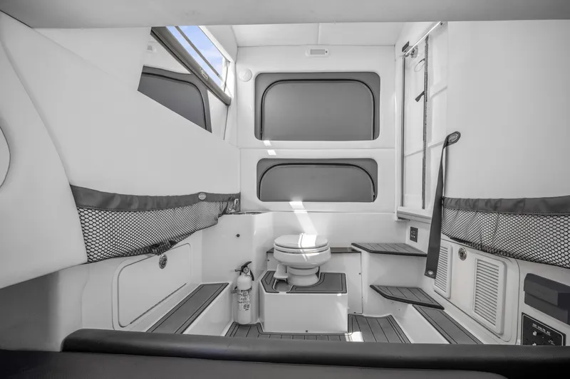 Slide: The Image of 2021 Nor-Tech 390 Sport Center Console cabin interior with seating and storage. - 41