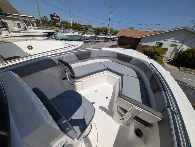 Slide: The Image of 2025 Robalo R232 Explorer boat interior with spacious seating and modern design. - 13