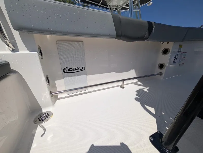 Slide: The Image of 2025 Robalo R232 Explorer boat interior with seating and drainage system. - 9