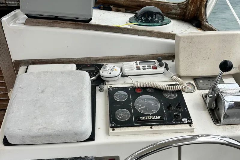 Slide: The Image of Control panel of a 1991 Fortier 26 Hard Top boat with navigation instruments. - 13