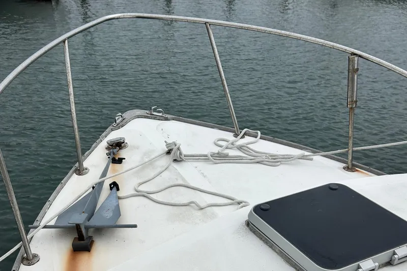Slide: The Image of Bow of 1991 Fortier 26 Hard Top boat with anchor and ropes. - 3