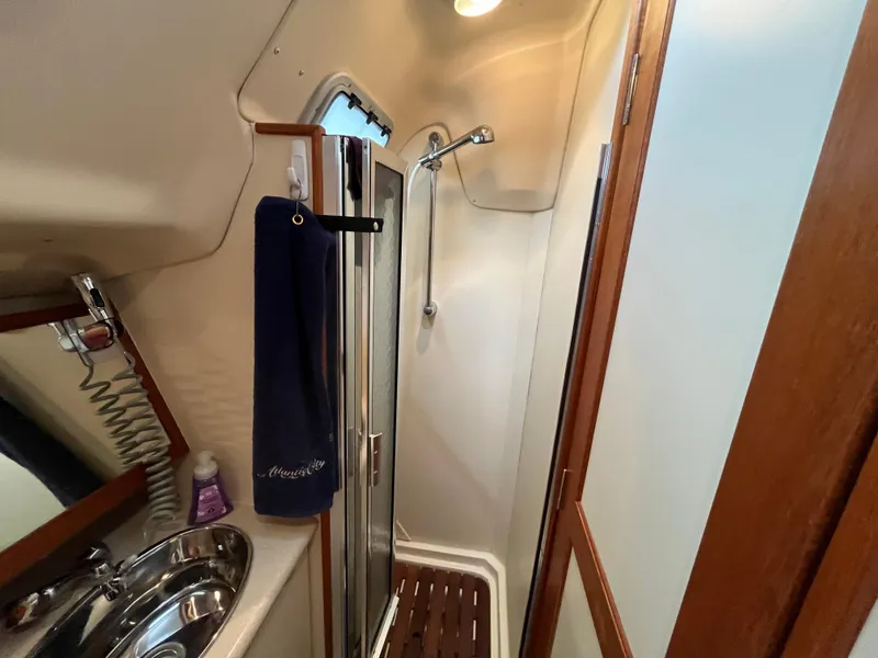 Slide: The Image of Compact bathroom in a 2004 Hunter 41 yacht with shower and sink. - 35