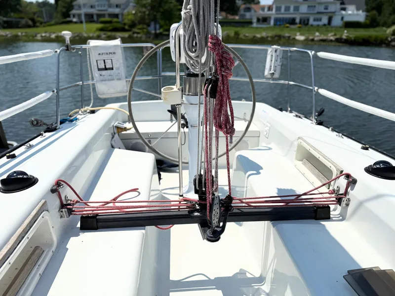 Slide: The Image of Cockpit of 1991 Tartan Thomas 35 sailboat with ropes and steering wheel. - 10