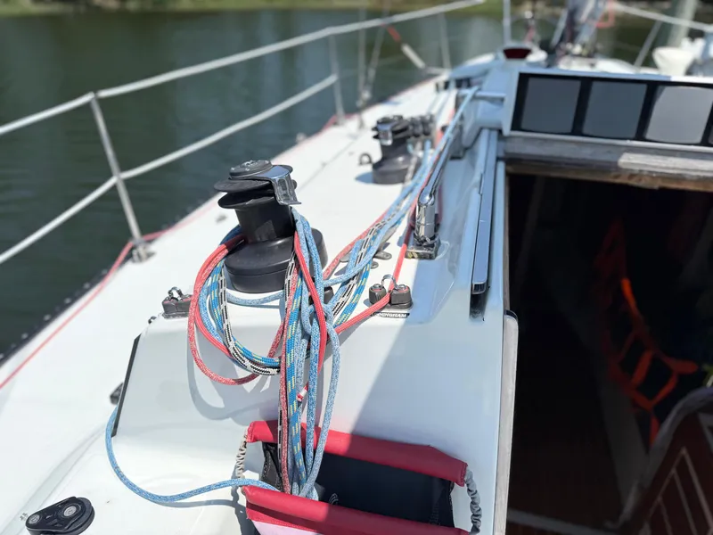 Slide: The Image of Sailboat deck of 1991 Tartan Thomas 35 with colorful ropes and winch. - 14