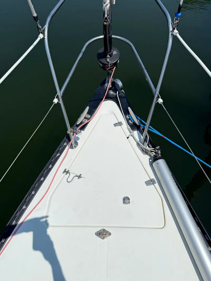 Slide: The Image of Bow of 1991 Tartan Thomas 35 sailboat with rigging and deck details. - 5