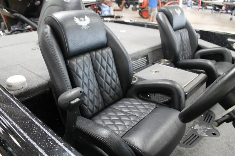 Slide: The Image of Luxurious black leather seats in a 2025 Phoenix 21 XE boat interior. - 4