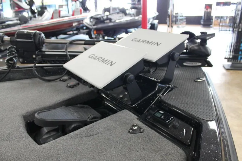 Slide: The Image of 2025 Phoenix 21 XE boat with dual Garmin displays on the dashboard. - 8