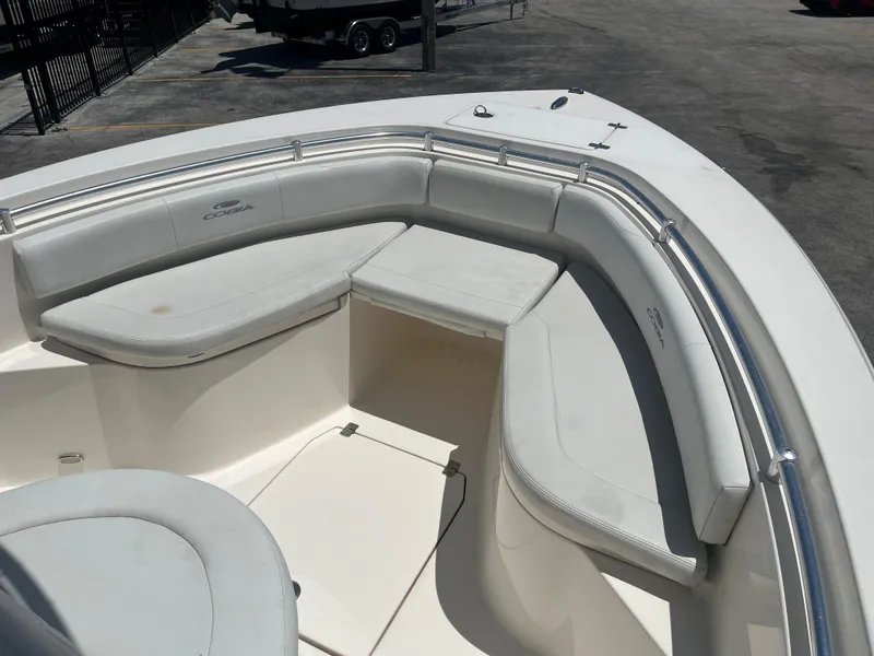 Slide: The Image of 2021 Cobia 237 Center Console boat with spacious seating area and sleek design. - 10