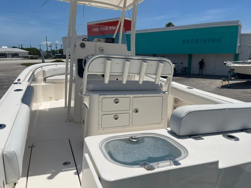 Slide: The Image of 2021 Cobia 237 Center Console boat interior with seating and storage compartments. - 8