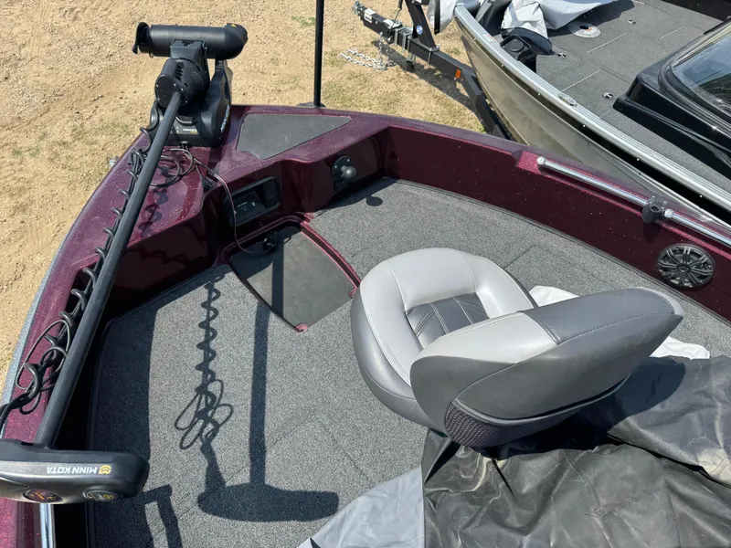 Slide: The Image of 2019 Nitro ZV19 Sport boat interior with gray seating and carpeted deck. - 12