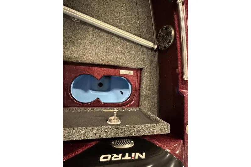 Slide: The Image of 2019 Nitro ZV19 Sport boat interior with storage compartment and speaker. - 17