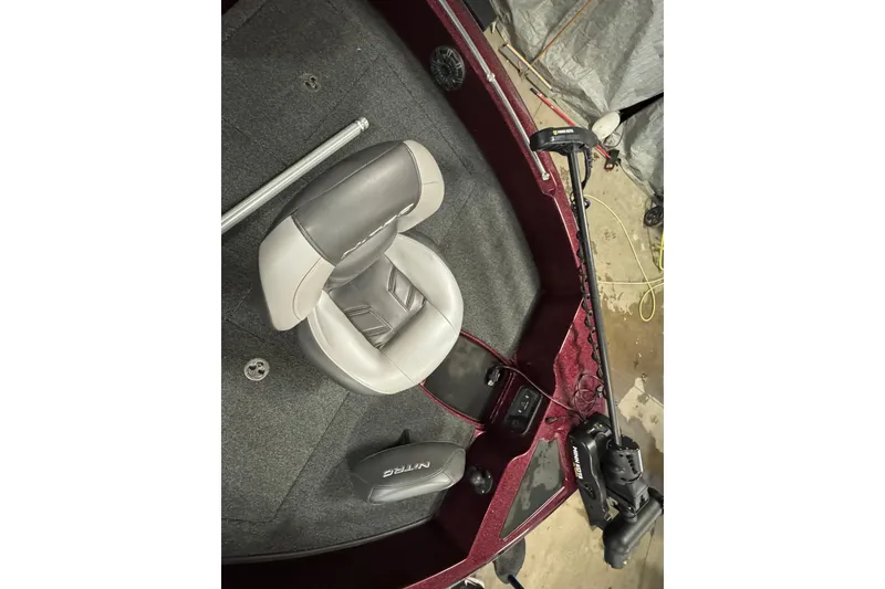 Slide: The Image of 2019 Nitro ZV19 Sport boat interior with gray seat and trolling motor. - 18