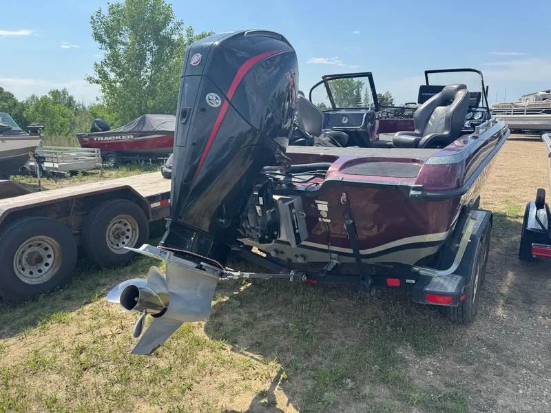 Slide: The Image of 2019 Nitro ZV19 Sport boat with powerful outboard motor in a garage setting. - 4