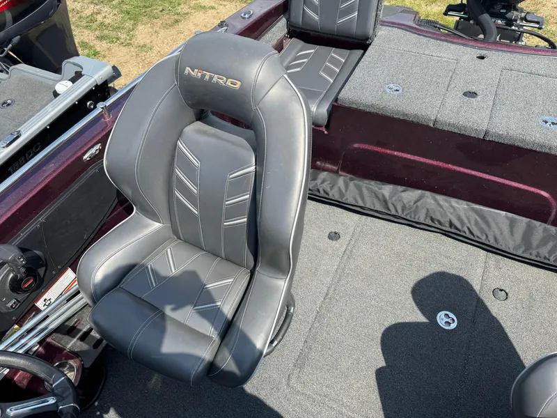 Slide: The Image of 2019 Nitro ZV19 Sport boat interior with two gray seats and storage compartments. - 6