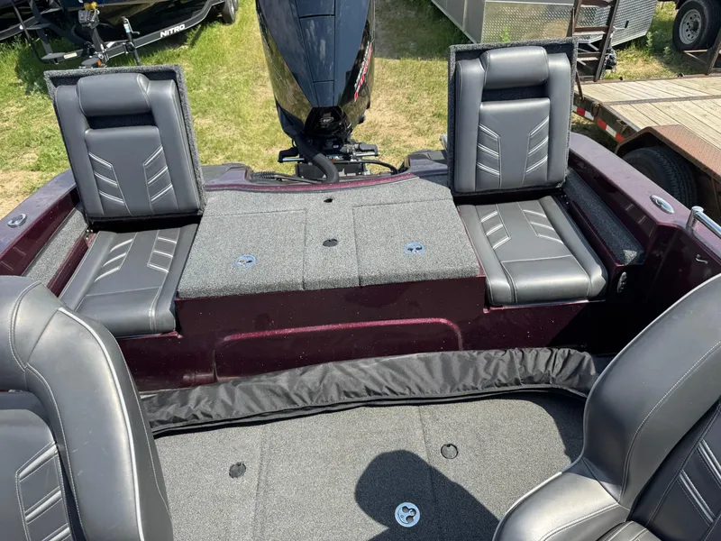 Slide: The Image of 2019 Nitro ZV19 Sport boat interior with steering wheel and cushioned seat. - 7
