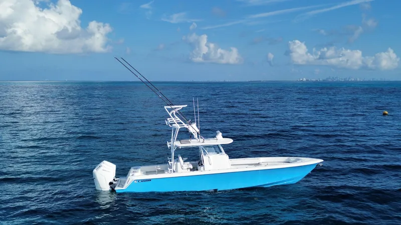 The Image of 2024 Contender 39 ST boat on open ocean under blue sky. - 0