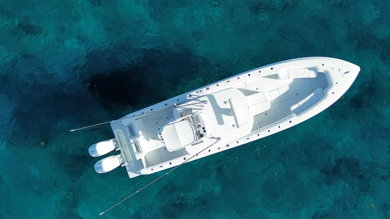 Slide: The Image of Aerial view of 2024 Contender 39 ST boat on clear blue water. - 11