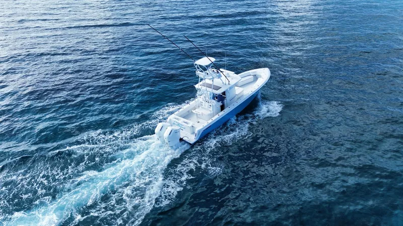 Slide: The Image of 2024 Contender 39 ST boat cruising on open ocean waters. - 19
