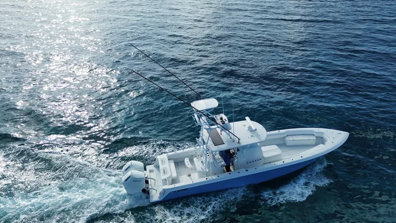 Slide: The Image of 2024 Contender 39 ST boat cruising on open ocean waters. - 20