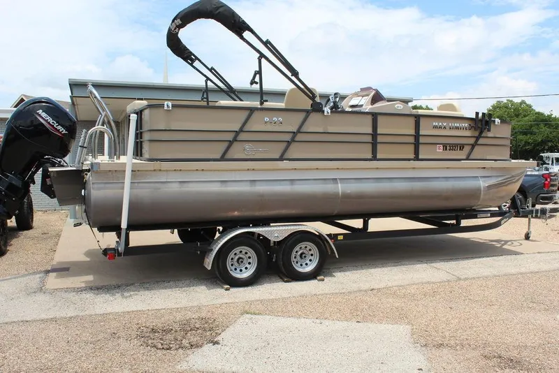 Slide: The Image of 2022 Massimo Marine P-23 TRITOON pontoon boat on trailer, featuring Mercury outboard motor. - 10