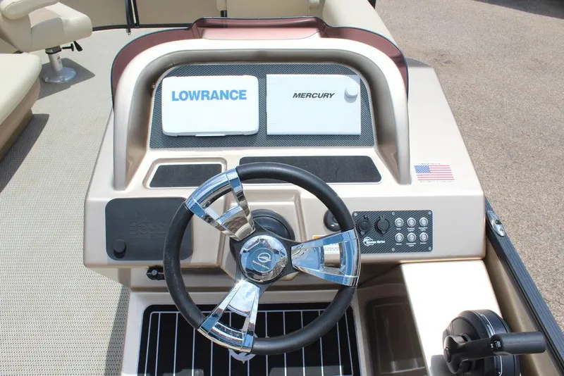 Slide: The Image of 2022 Massimo Marine P-23 TRITOON dashboard with steering wheel and control panel. - 13